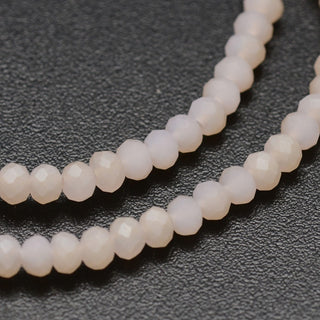 Crystal (Chinese) *Faceted Rondelle  (Blanched Almond)   3 x 2 mm.   Approx 200 Beads on an 18" Strand.