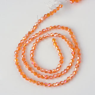 (3MM).  Dark Orange with an  AB Coating.  Bicone Glass Bead 17" Strands, Grade AA, 3x3mm, Hole: 1mm